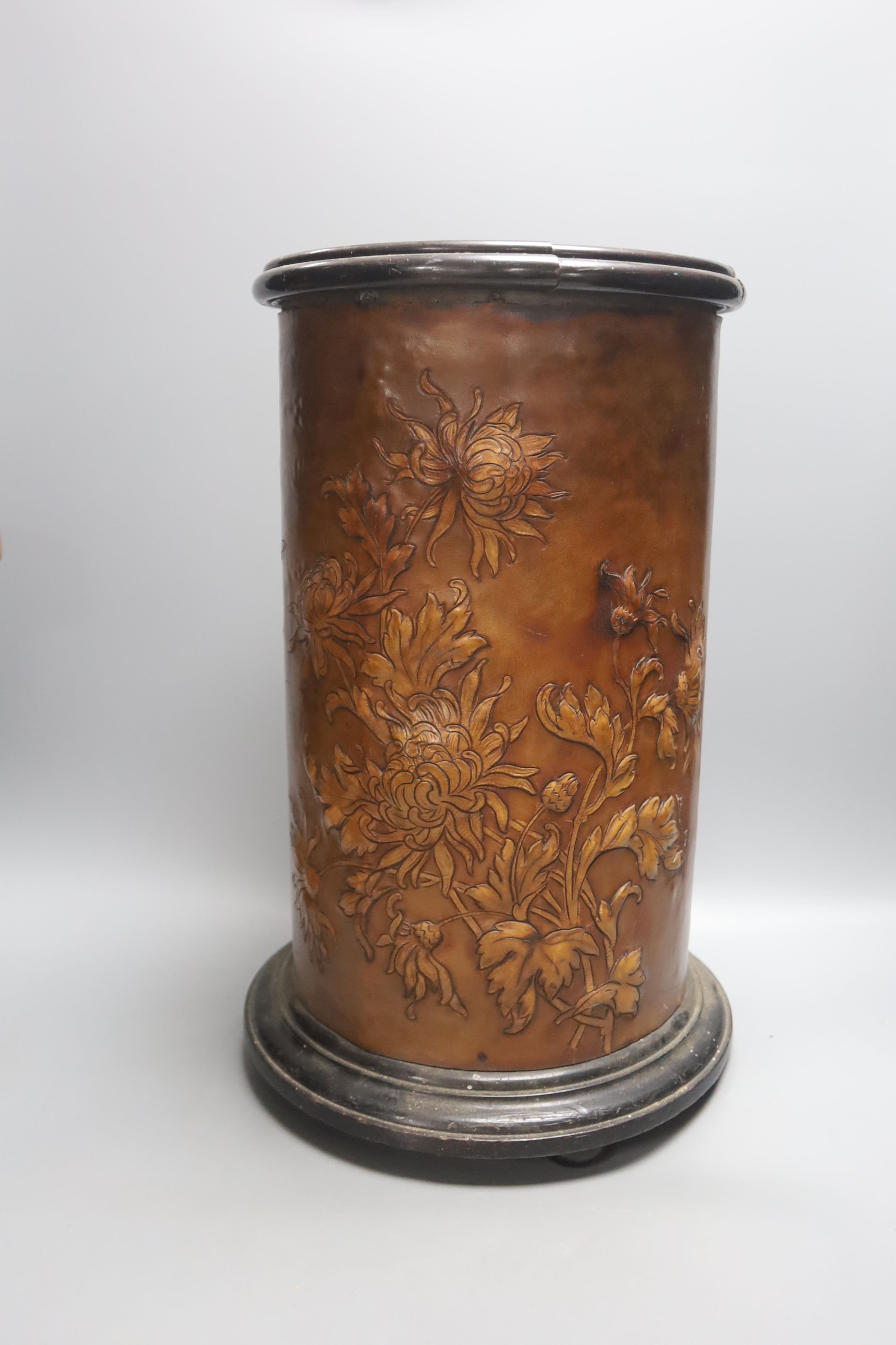 A Russian papier mache box, 26.5cm, an embossed leather stick stand, a Persian painted wood vase, metalware etc